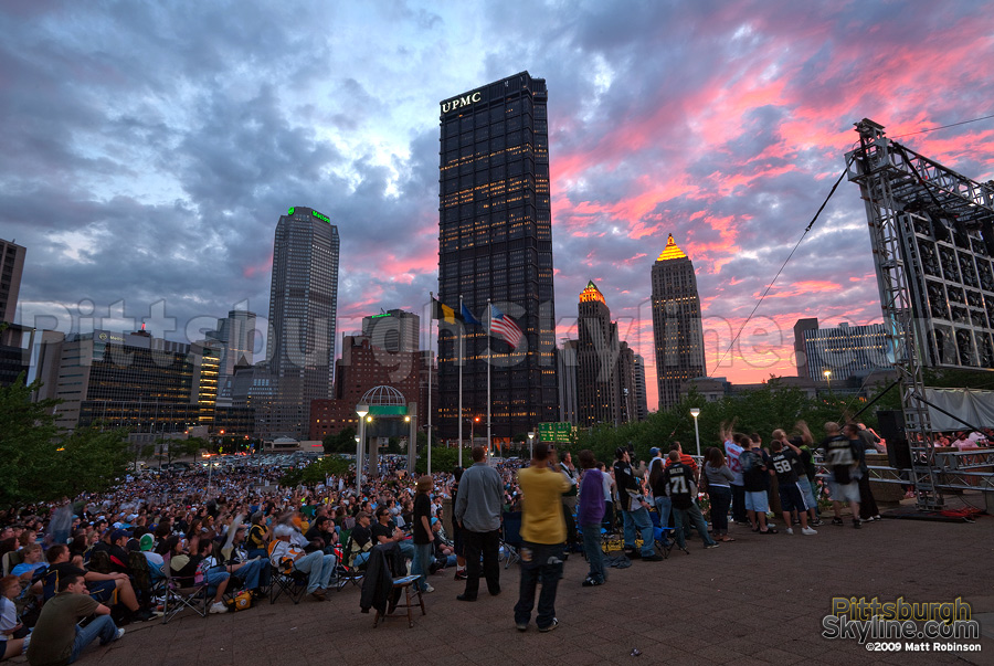 The sun sets behind downtown